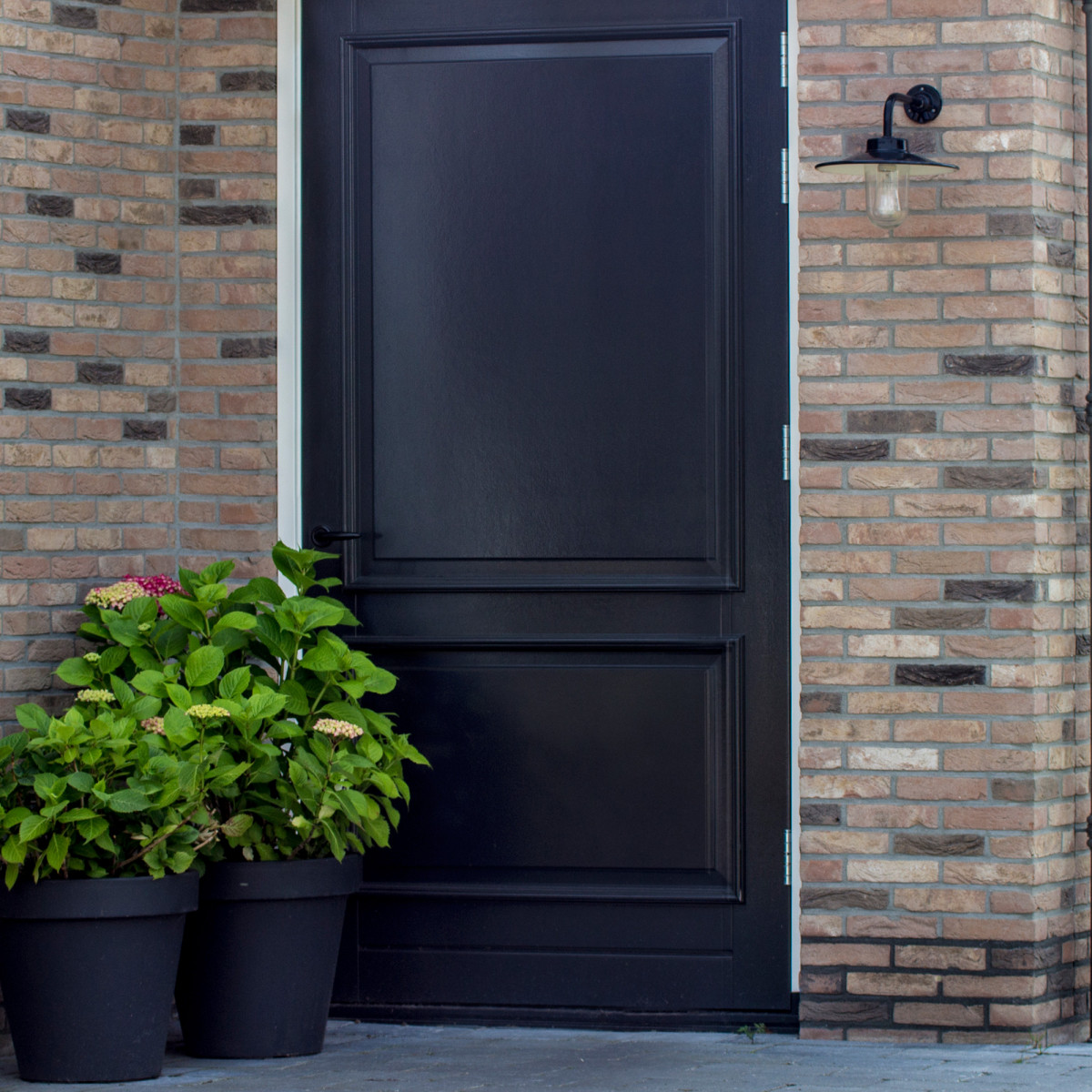 Schwarze Stallwandleuchte mit Bewegungsmelder – ländliches Design